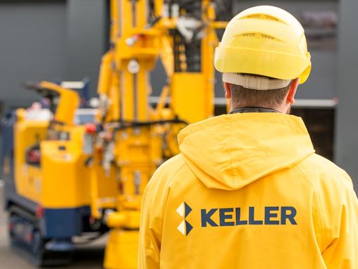man in yellow jacket with keller logo on the back 